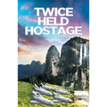Twice Held Hostage - Paperback